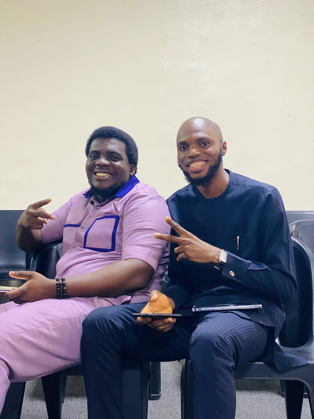 Two TEC members seated together