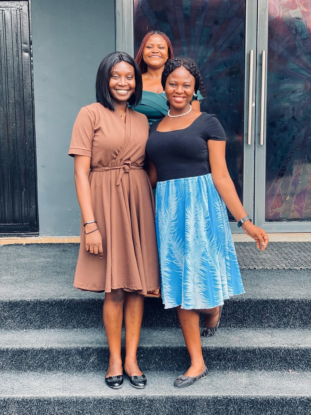 Three women outside This Excellent Church